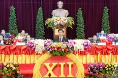 General Secretary of the Lao People's Revolutionary Party Thongloun Sisoulith delivers the opening speech at the opening session of the 12th National Congress of the Lao People’s Revolutionary Party (LPRP) on January 6. (Photo: VNA broadcasts)