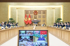 Prime Minister Pham Minh Chinh chairs an online conference with central provinces and cities on the “Quang Trung Campaign” on January 7. (Photo: VNA)