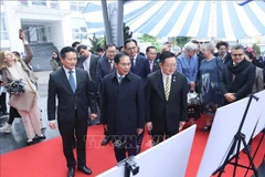 Deputy PM and Minister of Foreign Affairs Bui Thanh Son and delegates visit the exhibition. (Photo: VNA)