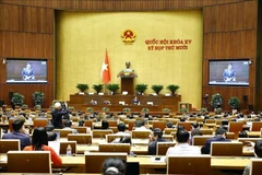 Minister of Finance Nguyen Van Thang clarifies issues raised by lawmakers. (Photo: VNA)