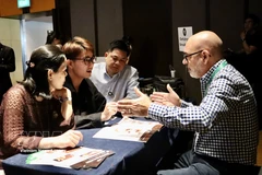 Australian and Vietnamese food enterprises discuss partnership on March 19. (Photo: VNA)