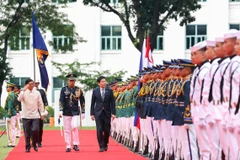 PM Lawrence Wong (centre) and Philippine President Ferdinand Marcos Jr (far left) reviewing an honour guard at Malacanang Palace in Manila on June 4. (Photo: MDDI) 