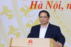 Prime Minister Pham Minh Chinh speaks at the national conference on the organisation of the high school graduation examination on June 18. (Photo: VNA)