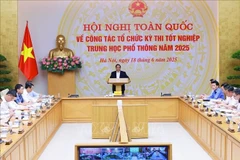 Prime Minister Pham Minh Chinh speaks at the national conference on the organisation of the high school graduation examination on June 18. (Photo: VNA)