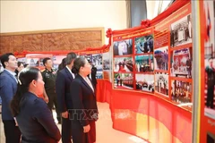 Delegates visit the exhibition. (Photo: VNA)