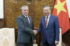 State President To Lam (right) receives Belarusian Ambassador to Vietnam Uladzimir Baravikou on July 3, 2024. (Photo: VNA)