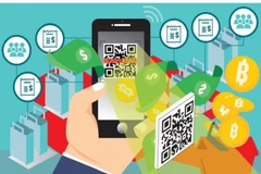 Multi-currency cards – a payment card supported by a mobile application that enables users to exchange local currency for foreign currency and make payments in stores or online - and mobile wallets for both daily and overseas spending will be popular in 2026. (Photo: courtesy of baochinhphu.vn)
