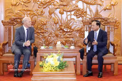 Politburo member, Secretary of the Party Central Committee and head of the committee's Commission for Information, Education and Mass Mobilisation Trinh Van Quyet holds a meeting with Canadian Ambassador to Vietnam Jim Nickel on June 16, 2026. (Photo: VNA)