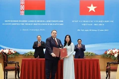 At the signing ceremony (Photo: Vietnamese Ministry of Foreign Affairs)