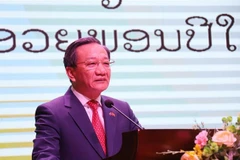 Vietnamese Ambassador to Laos Nguyen Minh Tam speaks at the get-together. (Photo: VNA)