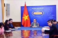 Vietnamese Minister of Foreign Affairs Le Hoai Trung at the phone talks with French Minister for Europe and Foreign Affairs Jean-Noël Barrot on December 23 (Photo: VNA)