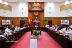 At the meeting of standing Government members on March 18, 2026 (Photo: VNA)