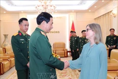 Minister of National Defence General Phan Van Giang (L) and Canadian Deputy Minister of National Defence Stefanie Beck. (Photo: VNA)