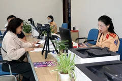 Processing administrative requests at the Public Service Centre of Quang Ninh province. (Photo: VNA)