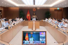 Deputy Prime Minister Nguyen Chi Dung chairs the first meeting of the inter-agency task force for coordinating smart city construction and development in Hanoi on July 16. (Photo: VNA)