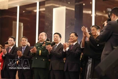 From left: Minister of Science and Technology Nguyen Manh Hung (fourth), Deputy Prime Minister Bui Thanh Son (fifth), Japanese Ambassador Ito Naoki (sixth), and delegates at the reception in Hanoi on March 3 to celebrate the 66th birthday of His Majesty Emperor Naruhito. (Photo: VNA)