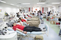 Youngsters donate blood at the National Institute of Haematology and Blood Transfusion in Hanoi. (Photo courtesy of NIHBT)