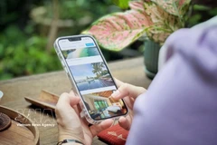 With just a smartphone, travellers can search for and book a variety of travel services for their journey. (Photo: VNA)