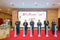 Delegates at the opening ceremony of the themed exhibition “The Revolutionary Path – Comrade Ho Chi Minh in China” in Chongqing. (Photo: baoquocte.vn)