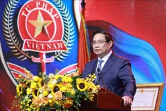 Prime Minister Pham Minh Chinh speaks at the event. (Photo: VNA)