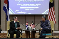 Malaysian Foreign Minister Seri Mohamad Hasan (right) and his Cuban counterpart Bruno Eduardo Rodriguez Parrilla in Kuala Lumpur on February 13. (Photo: Bernama)