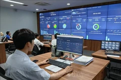 Monitoring of online application submissions and processing progress at the Intelligent Operations Centre (IOC) of Da Nang city. (Photo: VNA)