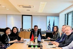 Vietnamese Ambassador Pham Thi Thu Huong meets with Greek Minister for Migration and Asylum Athanasios Plevris during a working session. (Photo: Published by VNA)