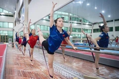 The Vietnamese gymnastics team train hard for the upcoming SEA Games 33. (Photo: hanoimoi.vn)