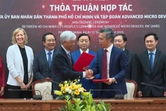 An overview of the MoU signing ceremony between the People’s Committee of Ho Chi Minh City and US semiconductor design giant Advanced Micro Devices, Inc. (Photo: VNA)
