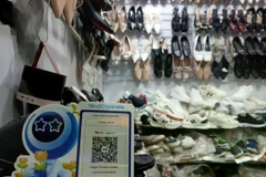 A kiosk selling footwear products. Fintech solutions should focus on simplicity, ease of use and affordability for small businesses and business households. (Photo: VNA) 