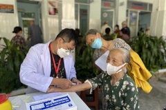 Senior citizens in HCM City get health check-ups. (Photo: VNA)