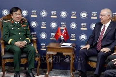 Visiting Deputy Minister of National Defence Sen. Lt. Gen. Hoang Xuan Chien (L) and Turkish Minister of National Defence Yasar Guler during their meeting on July 22.