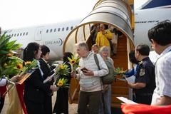 The ceremony welcoming the 20 millionth international tourist to Vietnam at Phu Quoc International Airport in December. (Photo: VNA)