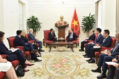 Minister of Foreign Affairs Le Hoai Trung meets with Canada's Minister of International Trade Maninder Sidhu on February 12, 2026. (Photo: Ministry of Foreign Affairs)