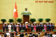 Party General Secretary To Lam, on behalf of deputies of the 16th National Assembly, presents flowers in congratulation to NA Chairman Tran Thanh Man, NA vice chairpersons, and NA Standing Committee members. (Photo: VNA)