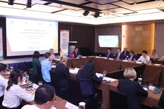 Participants at the meeting (Photo: VNA)