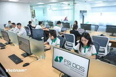 The draft Law on Digital Transformation defines management and administration in the digital environment as the default mode, with paper-based management as an exception. (Photo: VietnamPlus)