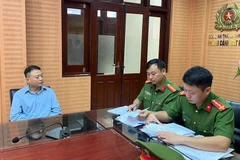 Nguyen Hoa Binh (also known as Shark Binh), Chairman of the Board of NextTech Group, at the police investigation agency. (Photo: Hanoi Department of Public Security)
