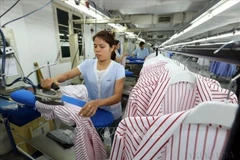 A garment production line at the Van Laack ASIA Co., Ltd., a German-invested enterprise located in Ngoc Hoi Industrial Cluster of Hanoi. (Photo: VNA)