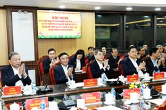 Party General Secretary To Lam (first, left) and delegates attend a conference to collect comments and confidence of voters at the places of residence for local candidates for the 16th National Assembly. (Photo: daibieunhandan.vn)