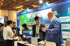 Products are promoted at the event. (Photo: VNA)