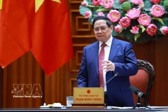 Prime Minister Pham Minh Chinh addresses the meeting. (Photo: VNA)