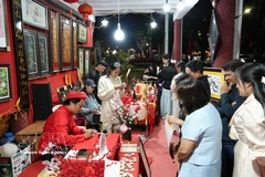 Visitors explore a calligraphy writing space in Thuan Hoa ward, Hue city, during the Lunar New Year 2026. (Photo: VNA)