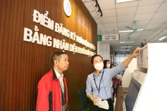 A man registers for health check-up through face ID at Saint Paul General Hospital (Photo: VietnamPlus)