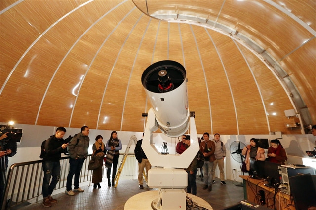 Visitors observe the sky at the Astronomical Observatory in Hanoi. (Photo: VNA)