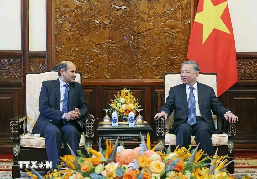 President To Lam (right) receives Indian Ambassador to Vietnam Sandeep Arya in Hanoi on June 26 (Photo: VNA)