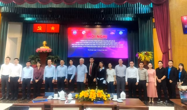 Delegates at the conference on implementing the digital transformation support programme for assessing the current status and readiness for e-commerce and digital transformation in HCM City. (Photo: courtesy of congan.com.vn)