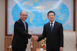 Deputy Prime Minister Ho Duc Phoc (R) receives President of Toyota Motor Asia Tien Quoc Hao on September 25. (Photo: VNA)