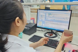 The healthcare sector is stepping up digital transformation to create favourable conditions for patients. (Photo: VietnamPlus)