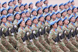 Female peacekeepers march at the ceremony marking the 80th National Day on September 2. (Photo: VNA)
